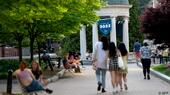 Students lounge and stroll on the campus of George Washington University in the USA